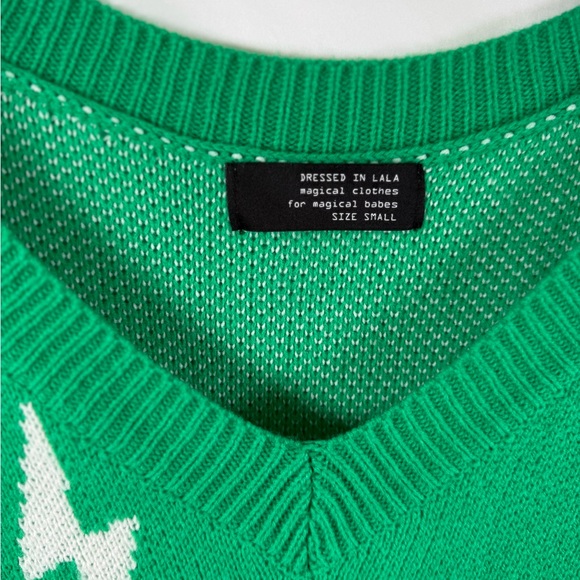 Dressed in LALA V-Neck Green Sweater with White Lightning Bolts - Picture 2 of 4
